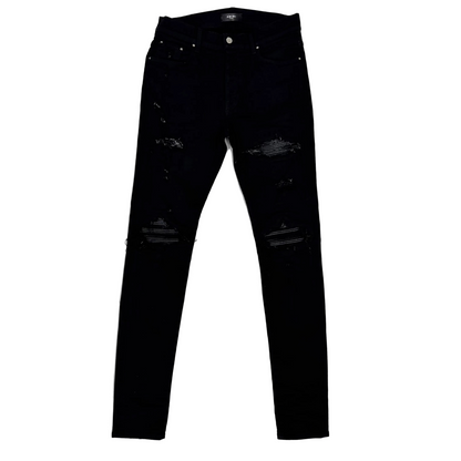 Amiri MX1 Distressed Black Patch Jeans (Pre-Owned)
