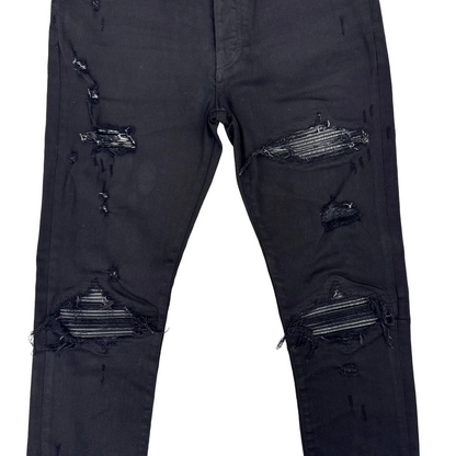 Amiri MX1 Distressed Black Patch Jeans (Pre-Owned)