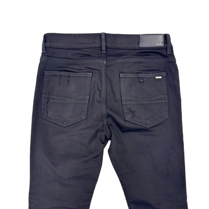Amiri MX1 Distressed Black Patch Jeans (Pre-Owned)